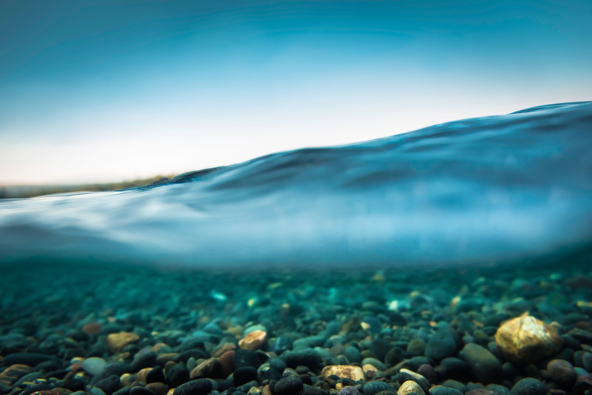 Closeup of rocks under blue water